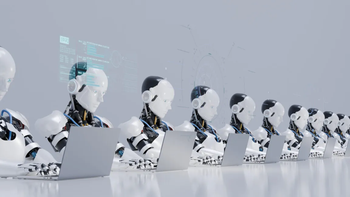 Digital generated image of multiple robots working on laptops siting in a row.