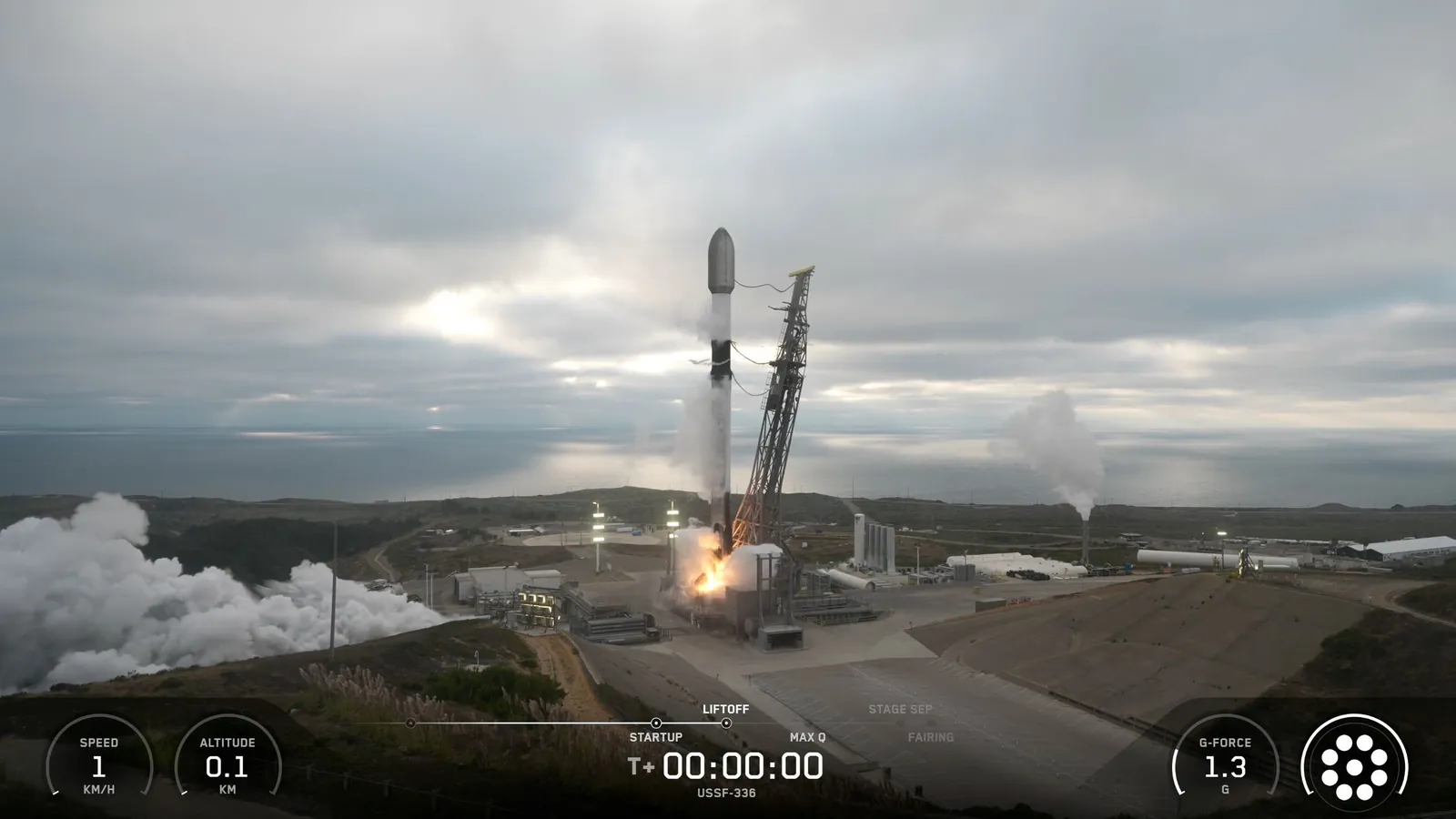 a black-and-white spacex falcon 9 rocket launches into a cloudy sky.