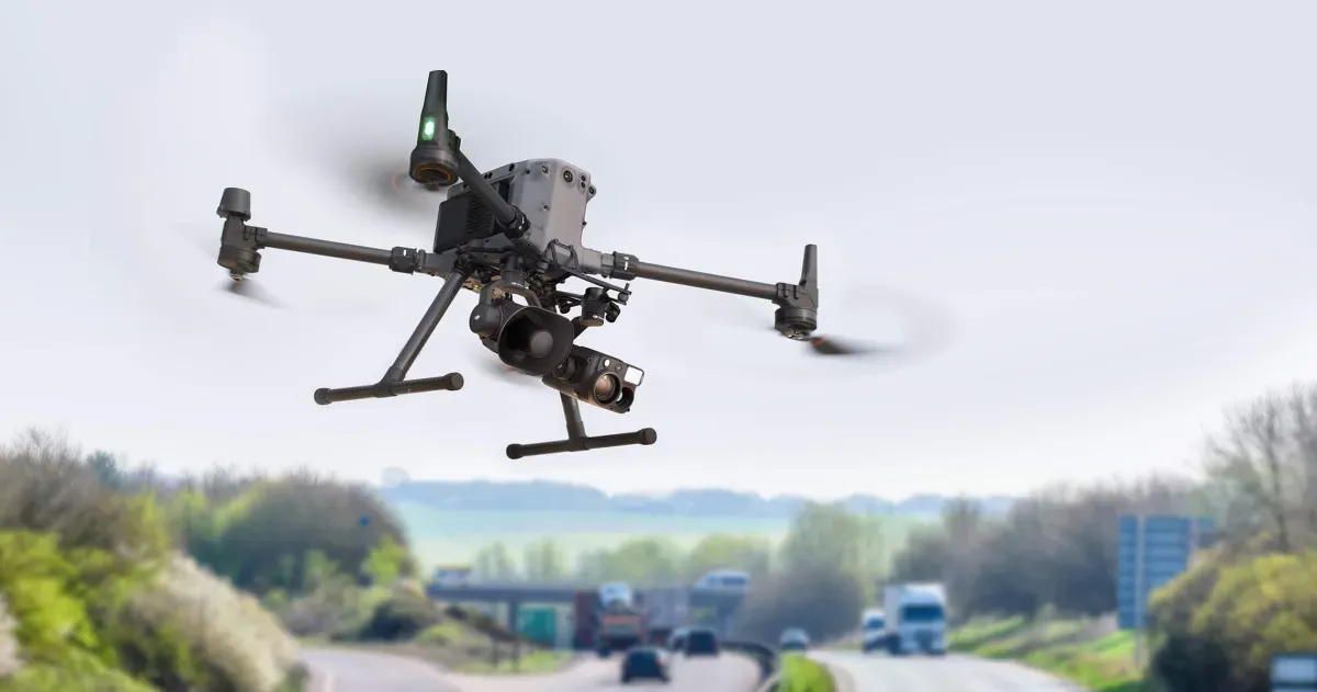 An image of a DJI drone with a Zenmuse V1 speaker accessory