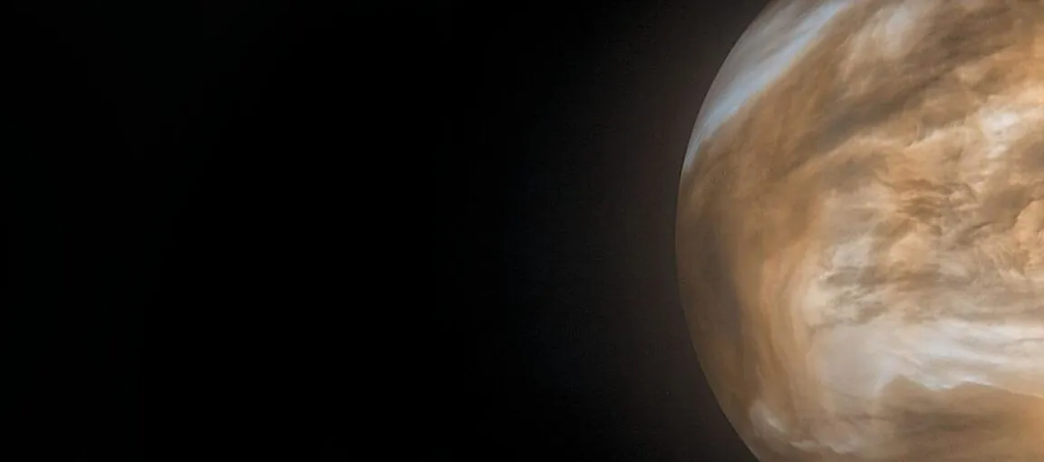 Image of a yellow brown planet on the right of a wide field view.
